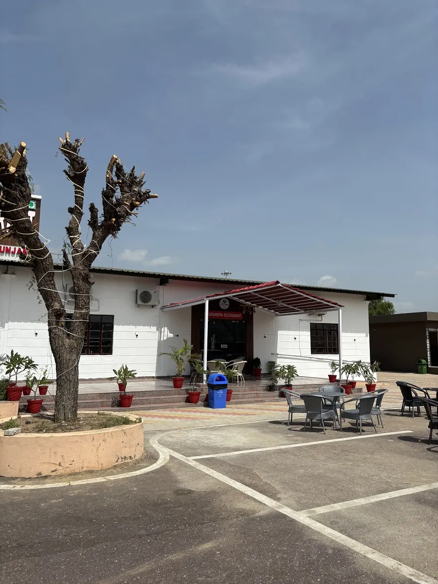 Guru Kripa restaurant entrance and outdoor seating, Agolai