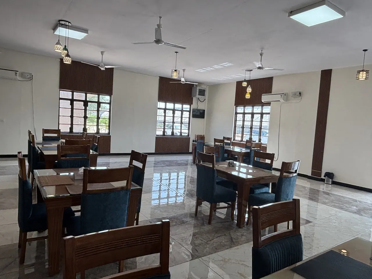 Bright AC dining hall at Guru Kripa pure veg restaurant, Agolai
