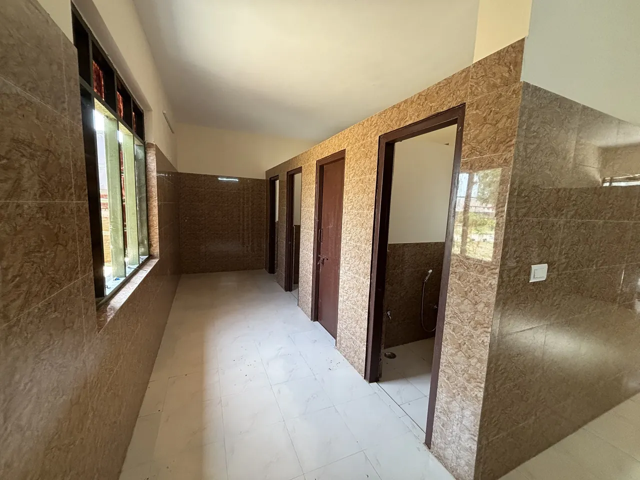 Tiled washroom block at Guru Kripa, Agolai