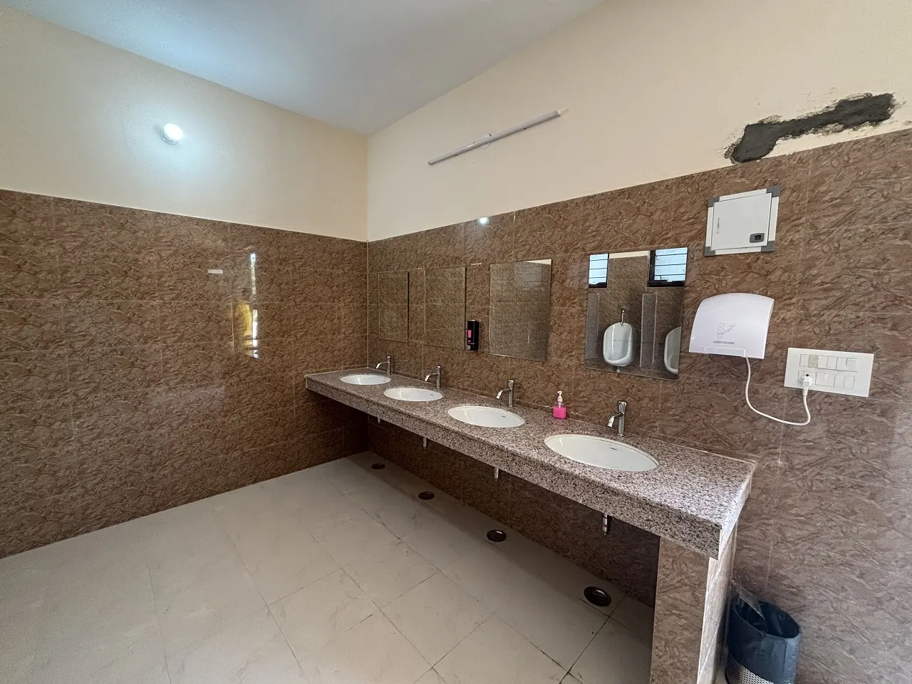 Clean washroom with wash basins at Guru Kripa, Agolai, on the Bharatmala Expressway